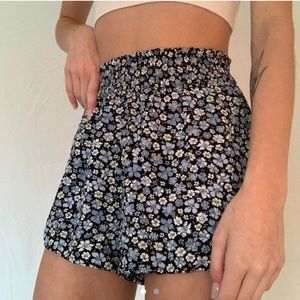 Silky blue floral shorts, high waisted, cinched at the waist